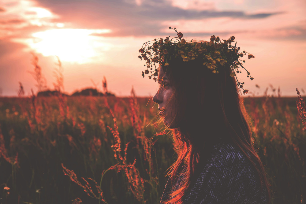 flower crown in a field at sunset