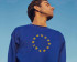 man with closed eyes and a european sweatshirt